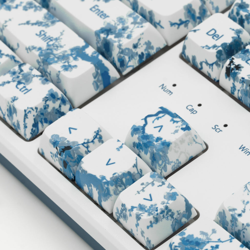 Blue Porcelain Flower Keycaps, inspired by blue and white Chinese Porcelain. Close up view of arrow keys.