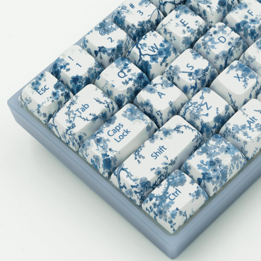 Blue Porcelain Flower Keycaps, inspired by blue and white Chinese Porcelain. 60% keyboard close up, left side. 