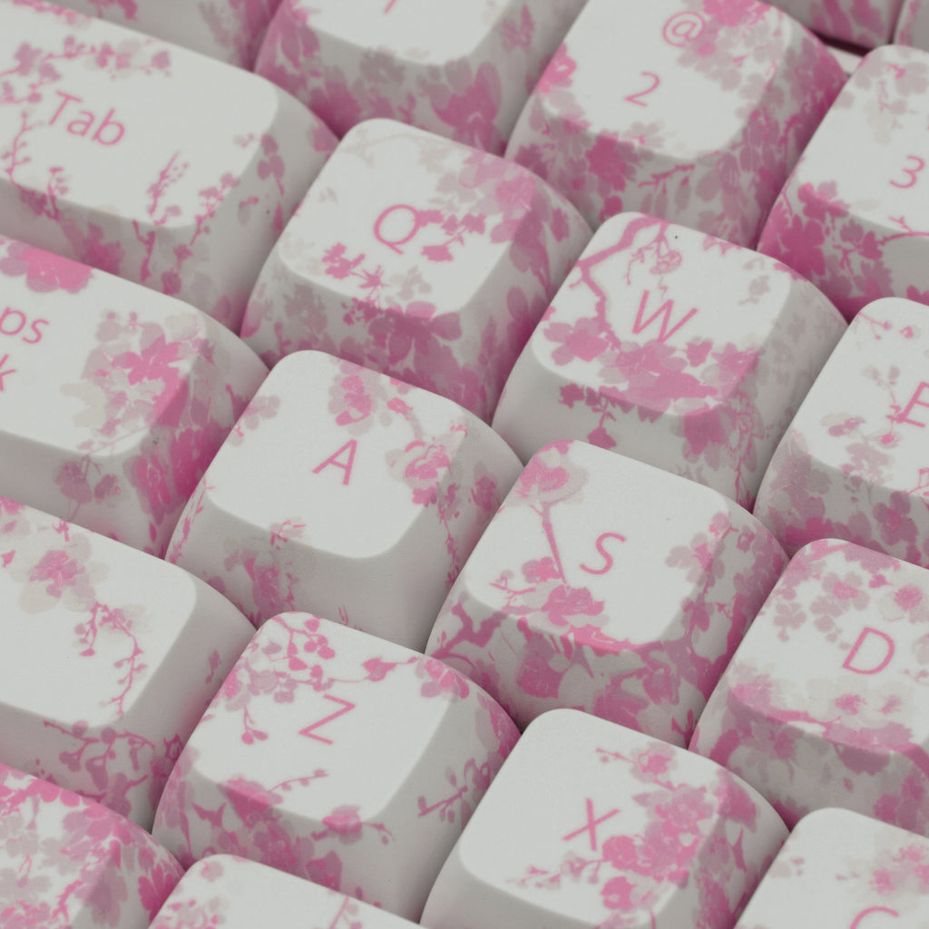 Pink Blossom keycaps featuring delicate floral designs. Left side close up. Middle close up.