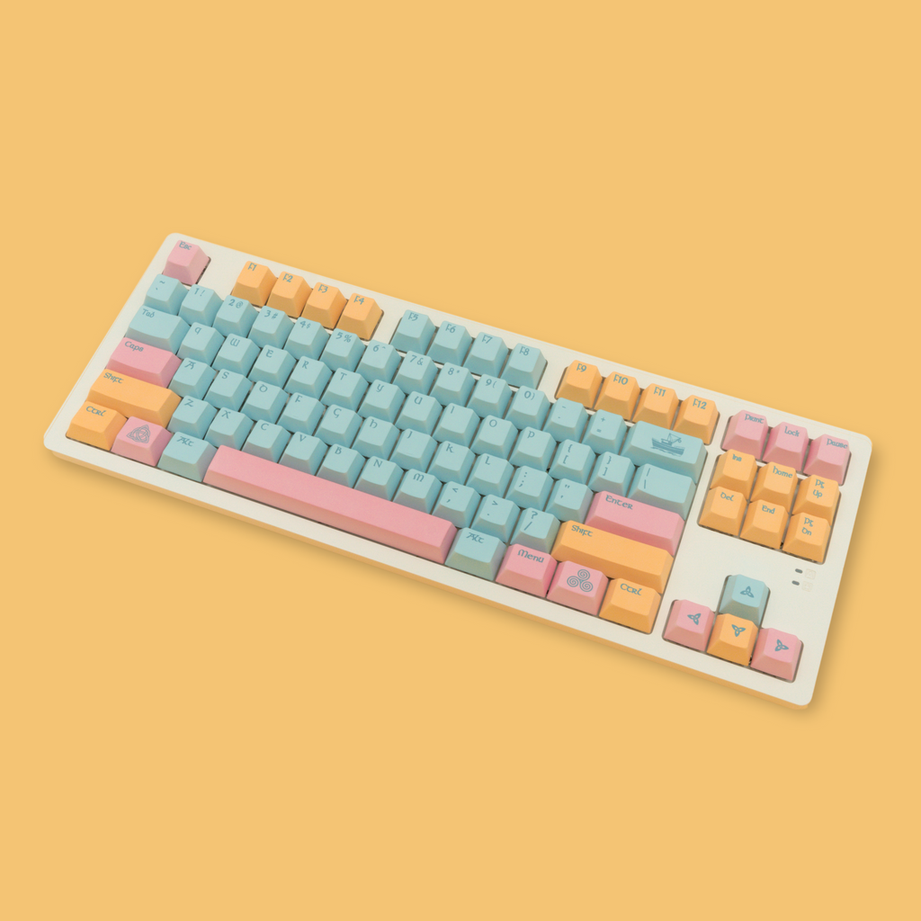 Portree keycaps inspired by the harbor town of Portree, featuring rich blues and pinks and yellows of the iconic downtown harbor buildings. Ariel view.