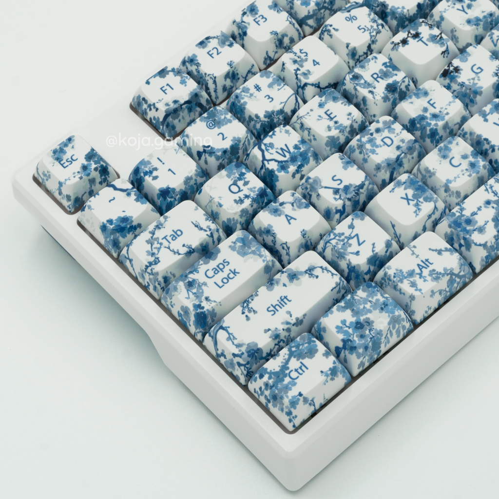 Blue Porcelain Flower Keycaps, inspired by blue and white Chinese Porcelain.  Close up left side view. 